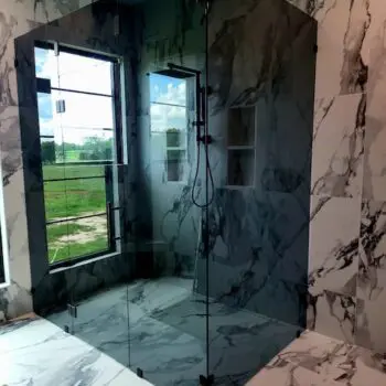 Shower with glass door enclosure
