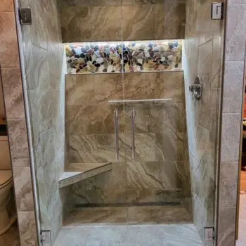 Glass shower with stone tiles