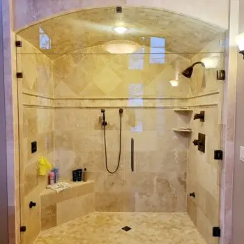 Spacious tiled glass shower interior