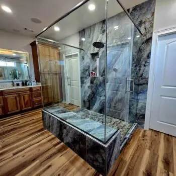 Glass shower with wood floor