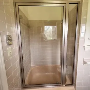 Glass shower door tiled bathroom