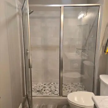 Glass shower with pebble floor