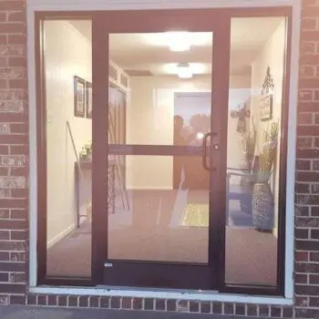 Glass door with brick wall