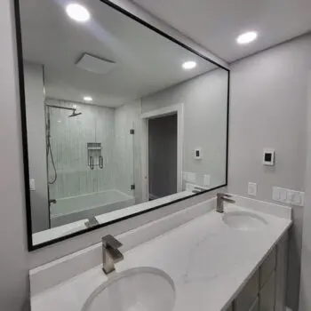 Modern bathroom with large mirror
