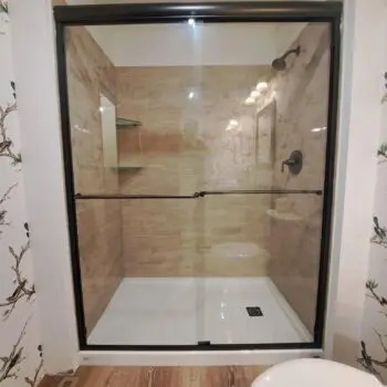 Glass shower door tiled bathroom
