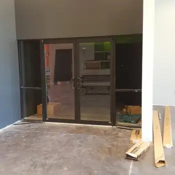 Glass door installation in progress