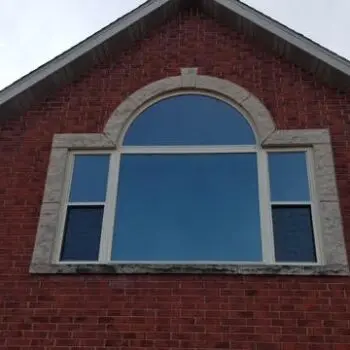 Brick house with arched window