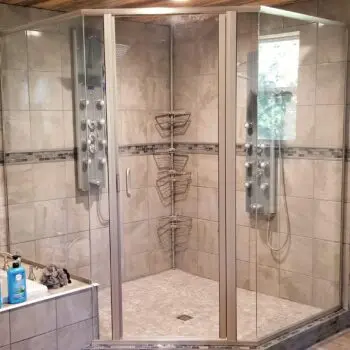 Glass shower enclosure with tile