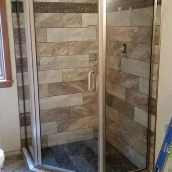 Glass shower door tiled enclosure