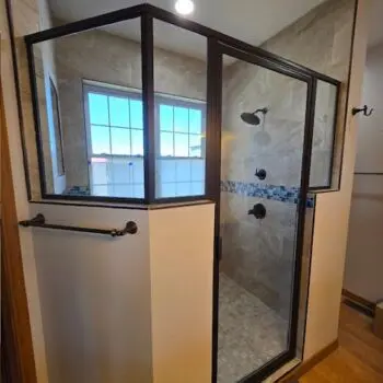 Glass shower with metal frame